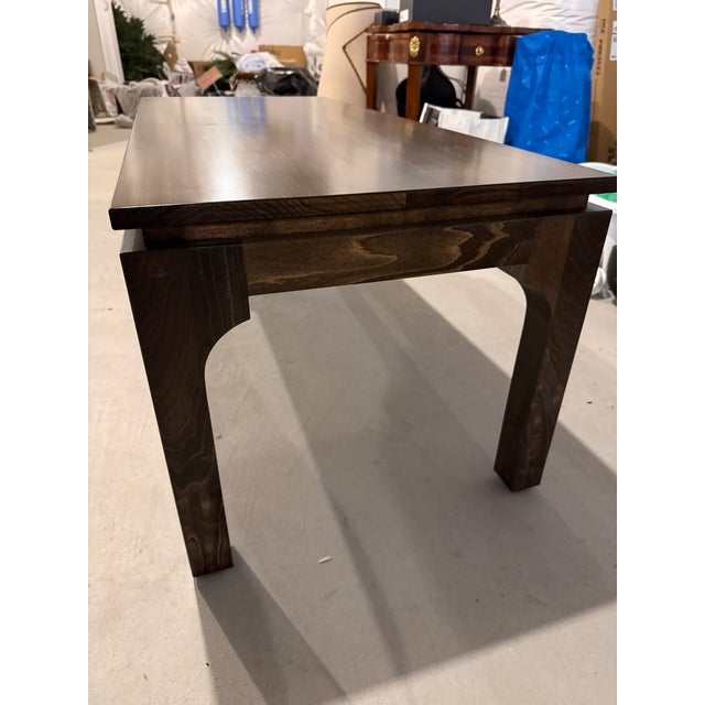 Gorgeous custom ming-style brown stained coffee table with a detailed reveal at top and straight leg on bottom. This table...