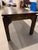 Gorgeous custom ming-style brown stained coffee table with a detailed reveal at top and straight leg on bottom. This table...