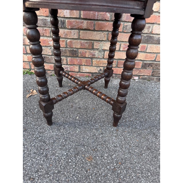 This antique English bobbin twist side table is perfect for any room with interesting cross bars is a wonderful and sturdy...