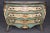 This extraordinary Venetian Rococo bombe commode, dating to circa 1870, is a true masterpiece of Italian decorative arts....