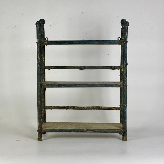 It's really about the stunning blue on this 3 tier wall hanging faux bamboo wooden shelf unit. The naturally developed...