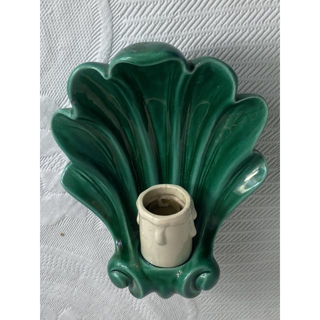 Vintage ceramic wall sconce, typical of French artisanal production from the 1950s. Uncommon model. The main structure of...