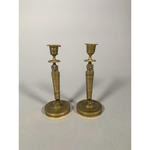 Bronze candlesticks from the Empire period, known as "return from Egypt", early 19th century. For Sale