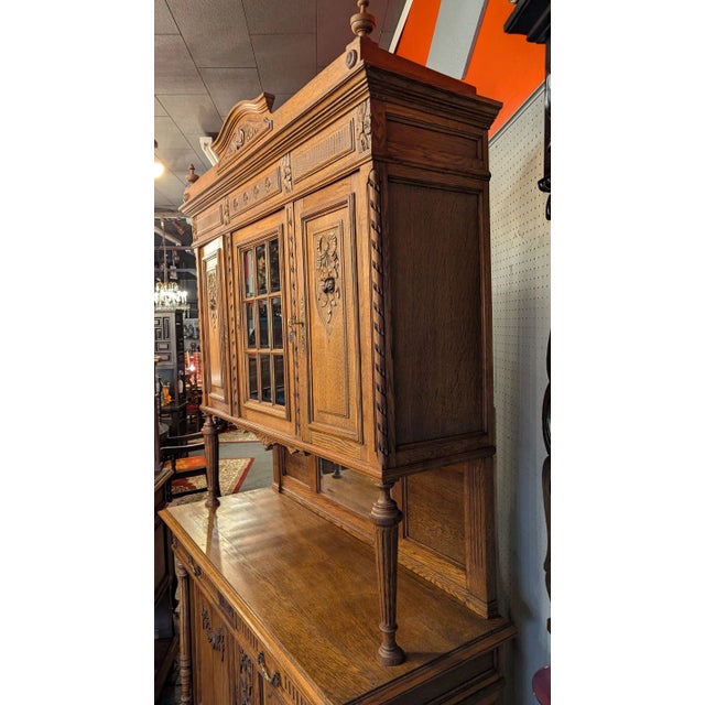 Stately 1880's French Oak Hunt Cabinet, columned base with two large door cabinet and two drawers. Center galley with...