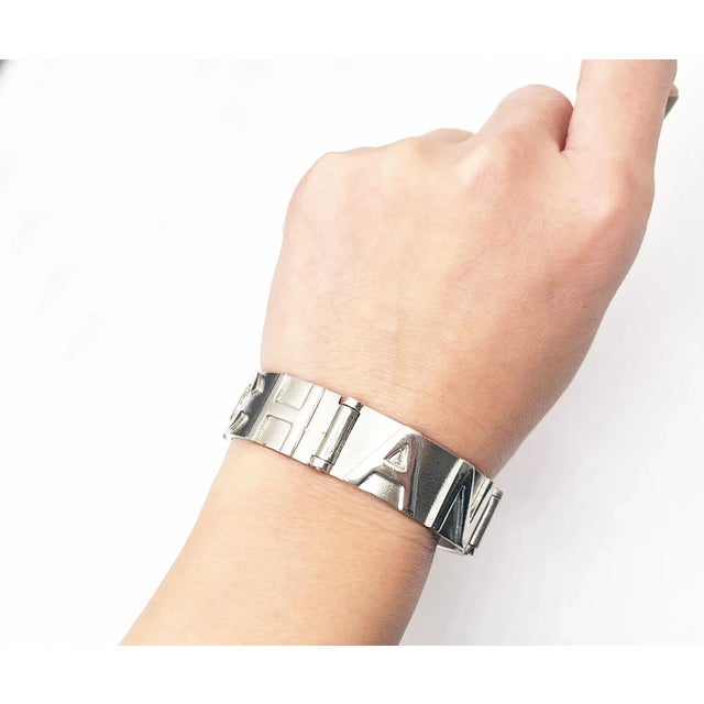 This is part of Chairish’s Costume Jewelry assortment. Chanel Rare Silver CC Letter Cuff Link Bracelet *Marked 98 *Made in...