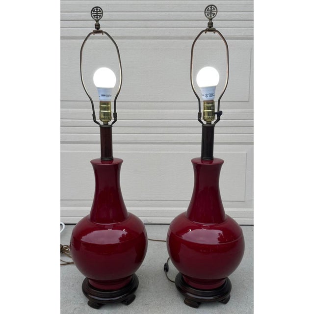 Pair of Vintage Chinese Oxblood Red Glazed Ceramic Table Lamps – 33.5" Tall Chinoiserie This striking pair of vintage...