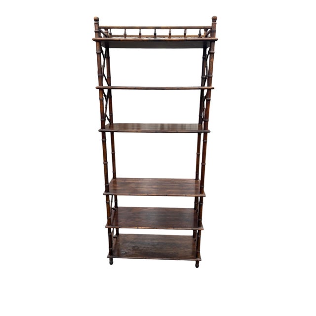 Attractive faux bamboo wood bookshelf. A wonderful accent piece adds a statement to any room.