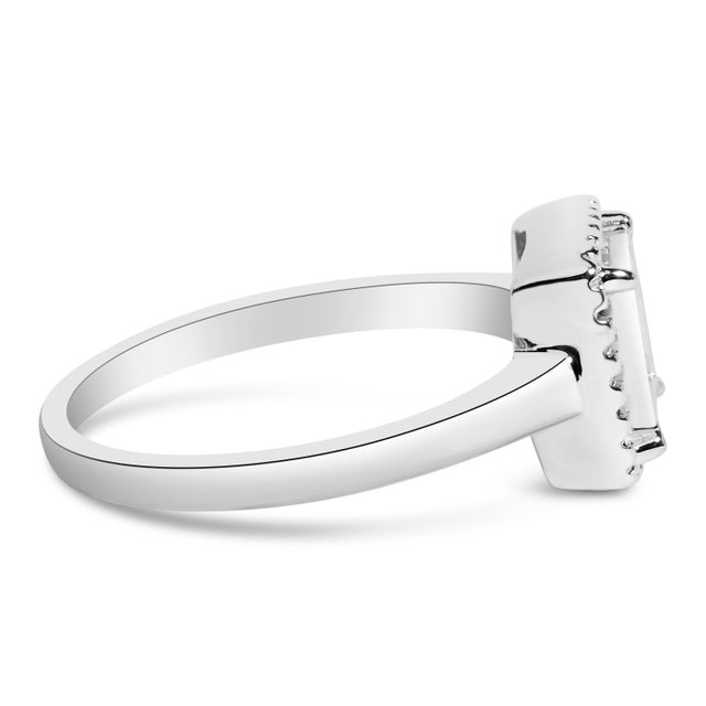 Imbued with timeless elegance, this sterling silver ring stands as a testament to love's enduring promise, It features an...