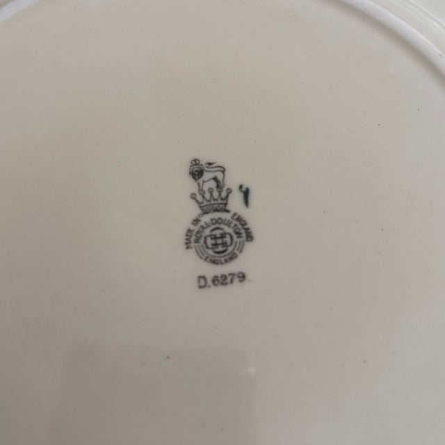 Royal Doulton the Falconer Plate circa 1909-1940. These plates are so beautifully painted. The colors are rich and soft....