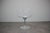 The chair features the characteristic sculptural transparent polycarbonate shell of the eros series, combined with a sleek...