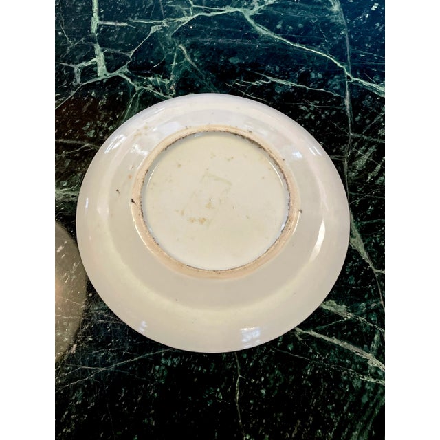 Lovely Chinese famille verte plate with figures, trees, flowers and birds.