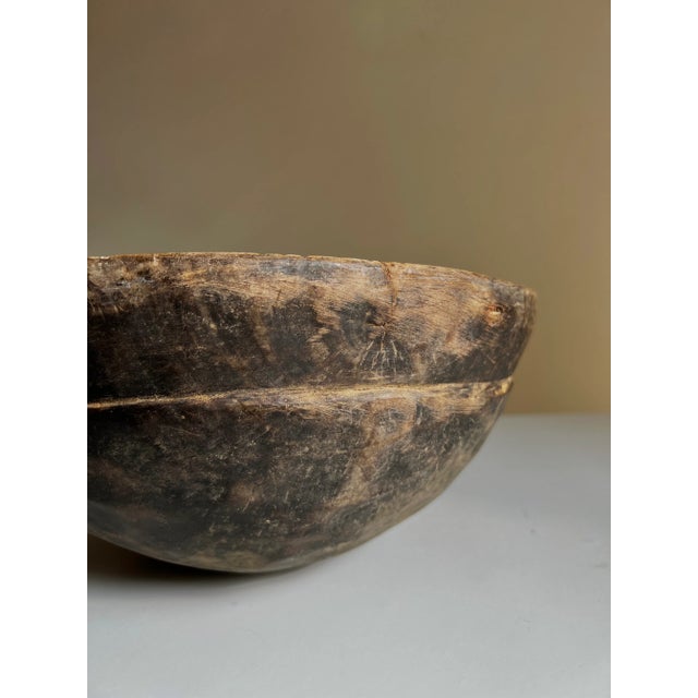This hand-carved milk bowl from West Africa is a one-of-a-kind vintage piece, believed to have been crafted by the Fulani...
