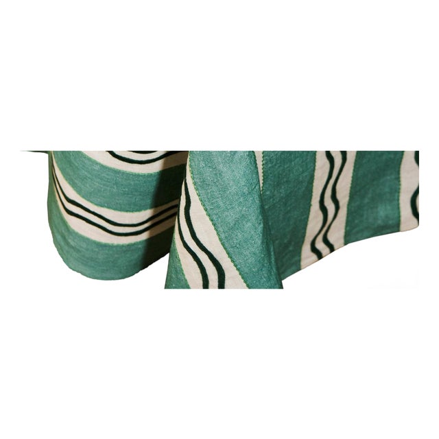 Our Monaco Stripe Tablecloth, hand-embroidered onto 100% linen in a deep, salon-room green — the stripe and squiggle...