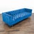 This stylish 3-seat sofa features luxurious blue velvet upholstery and deep tufted detailing for a modern, elegant look....