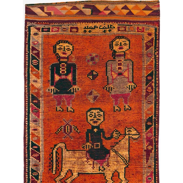 A vintage Turkish Anatolian rug, with a pictorial design and Kilim (flat-weave) ends, from the mid-20th century. Measures:...