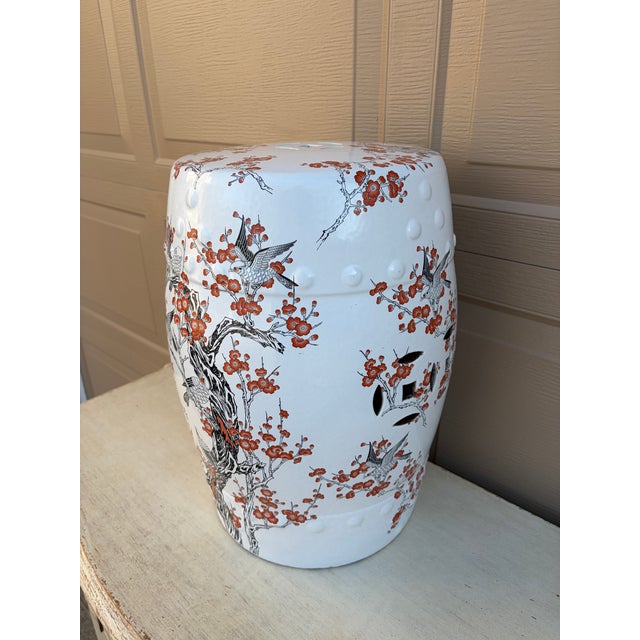 A gorgeous Chinoiserie orange and black porcelain garden stool, plant stand, or small side table featuring Asian motifs,...
