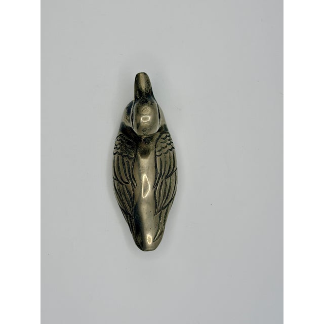 Charming vintage silver-tone duck figurine featuring softly sculpted curves and beautifully engraved feather details. This...