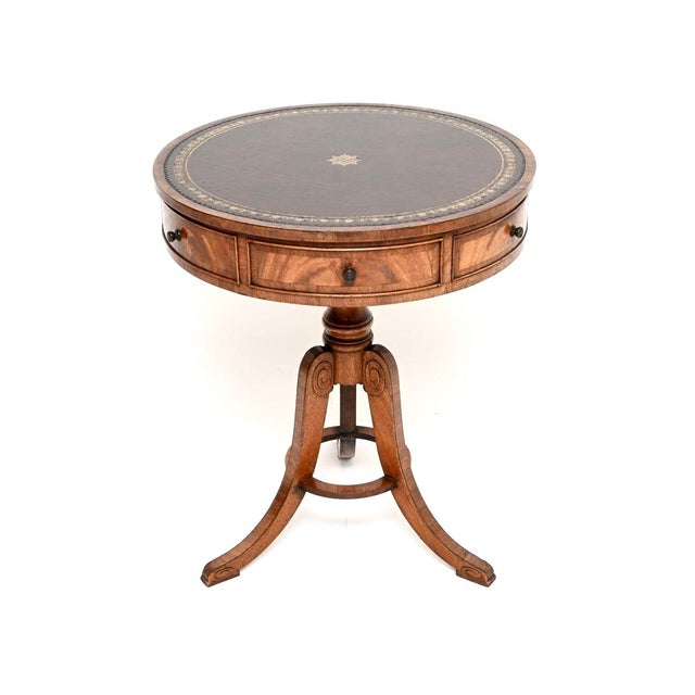 A smart and extremely well made antique leather top drum table. It is in the Regency style, this was made in England and...
