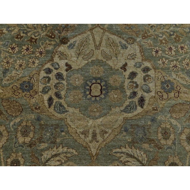 Origin: India Material: hand spun wool pile. Color: soft green Style: Tabriz Design: Haj Jalili Size: 11'9"x 15'8"