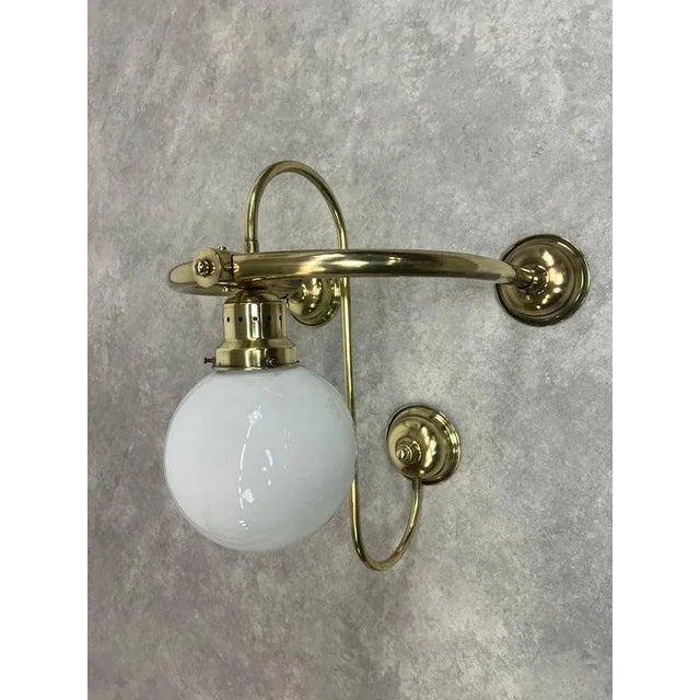 Large art deco brass wall lamp in excellent original condition. Up to 250V (Europe/UK Standard).The wiring of this item...