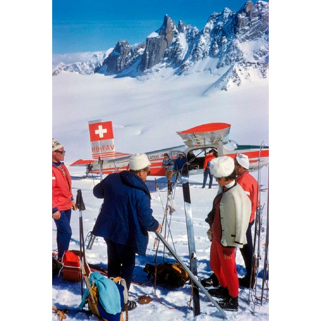 Landed At The Haute Route by Toni Frissell Skiers prepare for their journey through the infamous “Haute Route" next to a...