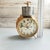 This rare antique German mechanical alarm clock—manufactured around 1900 by the renowned Hamburg-Amerikanische Uhrenfabrik...