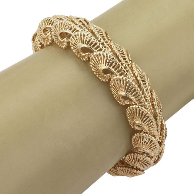 Crafted with elegance, this fancy open bracelet showcases a 15mm wide swirl link design, meticulously fashioned from 14k...