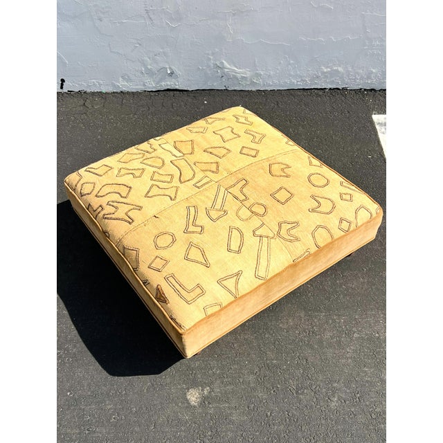This is is a 1990s unique and visually striking oversized gem. The combination of the reupholstered African Kuba Cloth and...