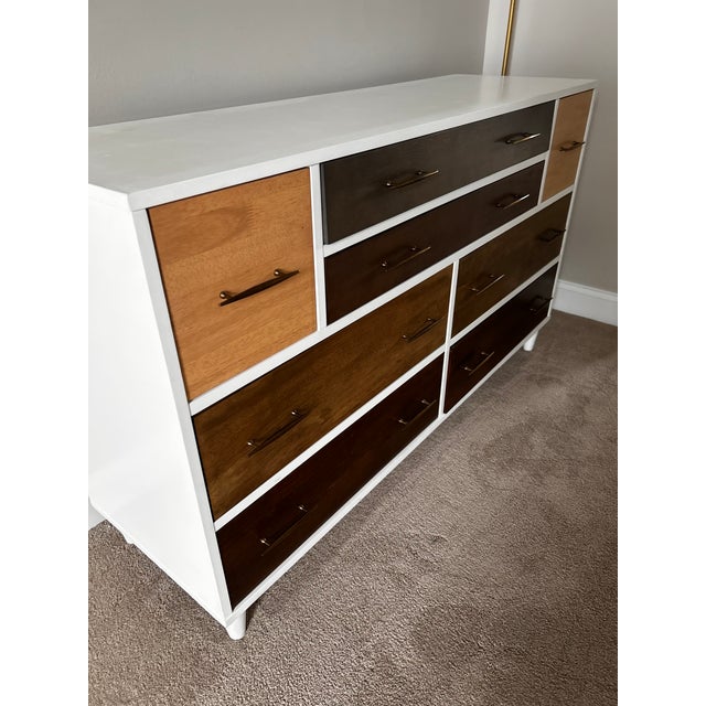 Beautiful, barely used 8 drawer dresser with soft close drawers. Brand and Manufacturer are unknown.