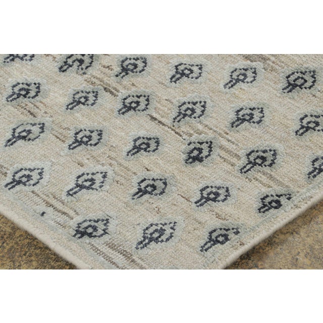 Made with hand-knotted natural silk, this approximately 3x6 runner rug is a sophisticated addition to Rug & Kilim’s Block...