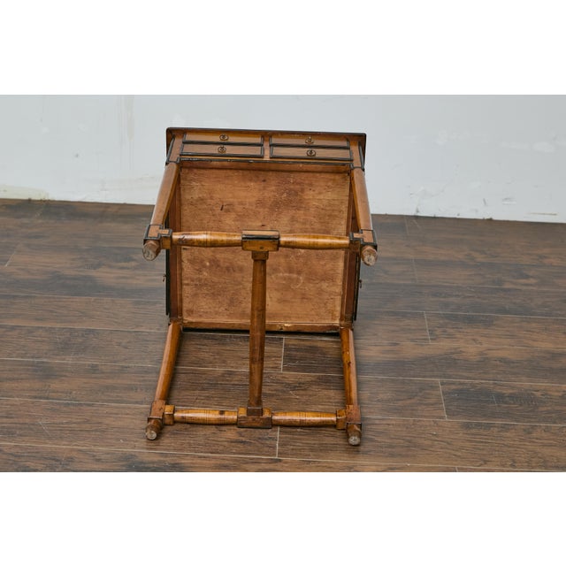 An English walnut spice table from the 19th century with multiple drawers. This 19th-century English walnut spice table...