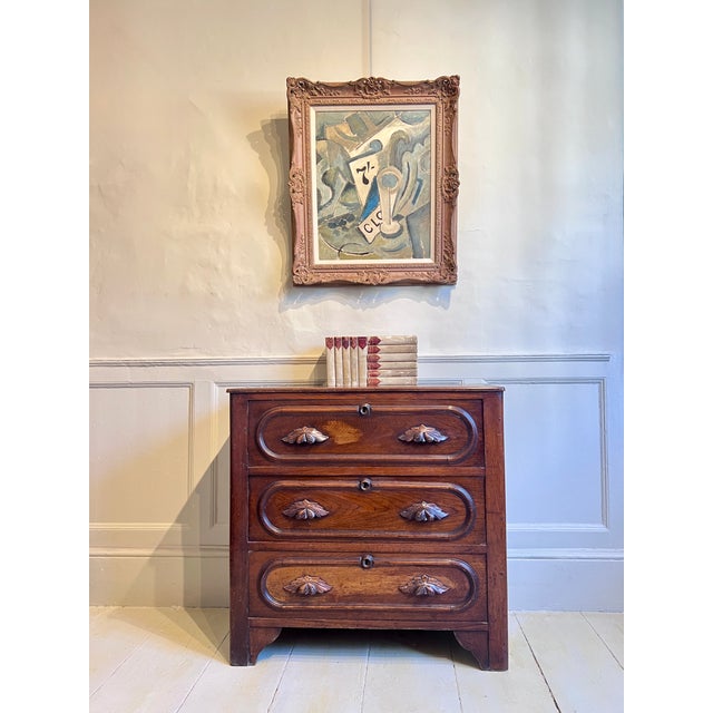 A handsome small-proportioned chest of drawers in oak, American and dating to the late Victorian period, circa 1880–90....