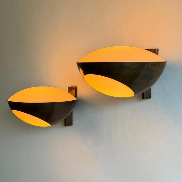 An iconic and rare pair of large-scale wall lights by Max Ingrand for Fontana Arte, produced around 1963. These sculptural...