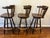 A matched set of three vintage Captain’s Mate swivel bar stools made in Yugoslavia. The stools have shaped solid wood...