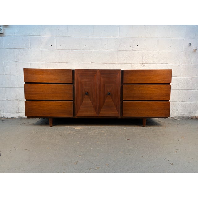 This striking mid-century modern dresser, designed by Merton Gershun for American of Martinsville, is a masterful example...