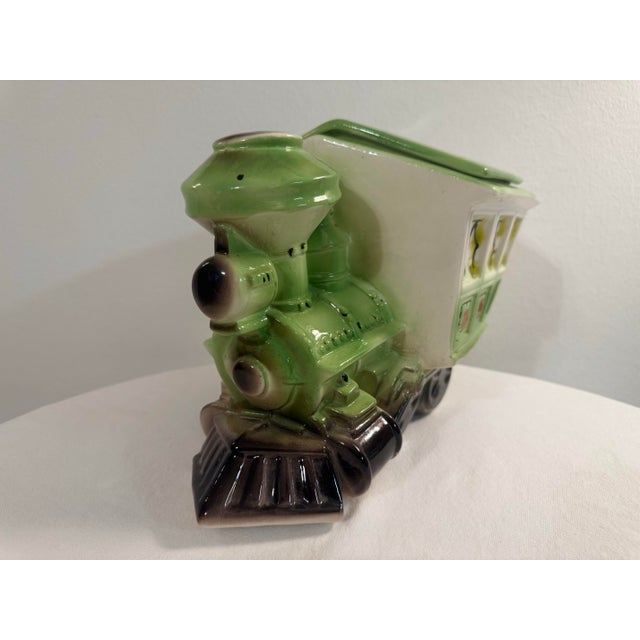 A whimsical and highly collectible vintage Maurice of California ceramic train cookie jar featuring a charming locomotive...