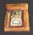 A 1970s ceramic tile by the American artist Mark Bulwinkle (born 1946). This ceramic piece depicts an abstract face...