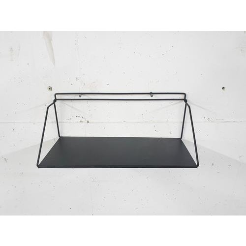 Pilastro style metal book shelf or kitchen shelf. The metal has been repainted in a matt black finish.