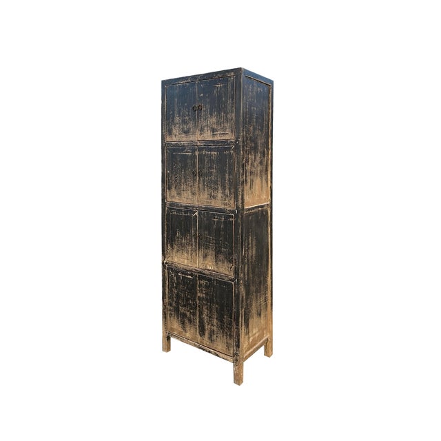 This Distressed Black Tan Marks Tall Slim 4 Shelves Closed Doors Storage Cabinet is a stylish and practical addition to...