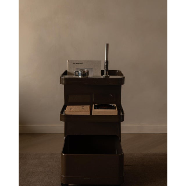 Vintage Marc Held trolley for Prisunic in brown plastic, a compact Space Age bar cart from the 1970s. The design features...