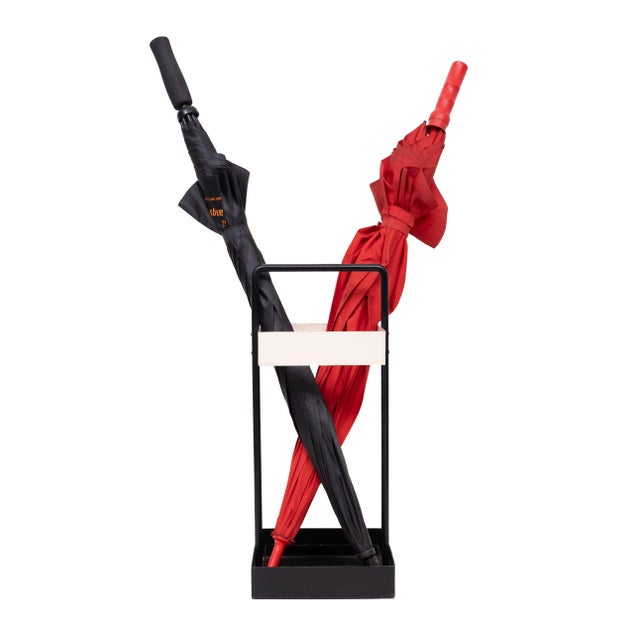 This modernist square umbrella stand of Black and white powder-coated metal is a rare design classic,. Black and white...