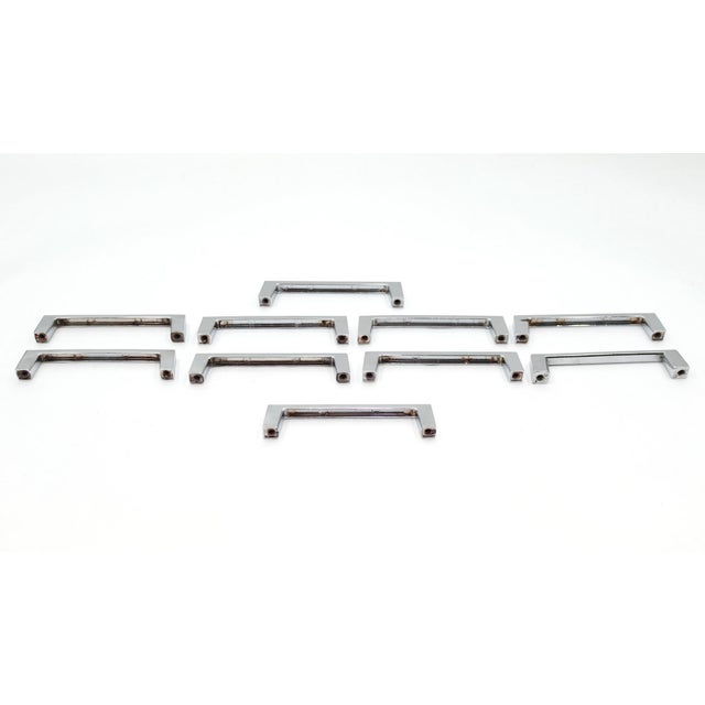 Modern style drawer or cabinet pulls made of brass with a chrome finish. Mounting screws are included. Old new stock - old...