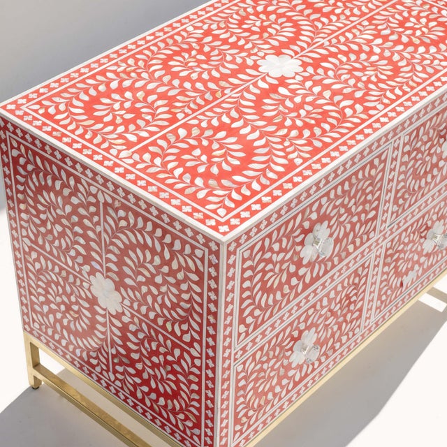 The Arabesque Mother of Pearl Inlay Four-Drawer Chest presents a vibrant interpretation of traditional floral...