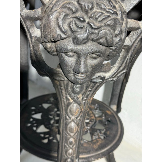 Neoclassical figure on cast iron base with marble top
