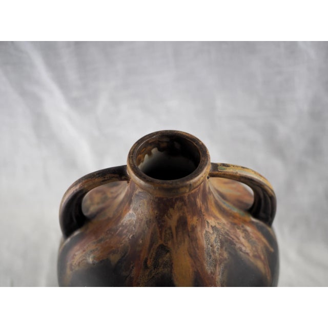 French impressive mat black and ocher / lava vase, stylised handles. Typical of Art deco movment, very aesthetic by its...