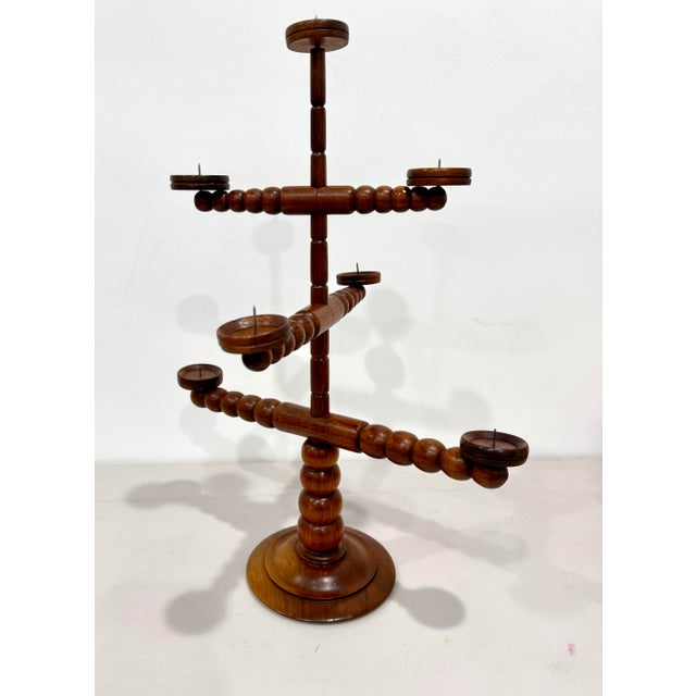 Vintage seven candle Bad Bevenser Siebenstern movable, turned wood candelabra by the German artists Hartwig Schmidt. Used...