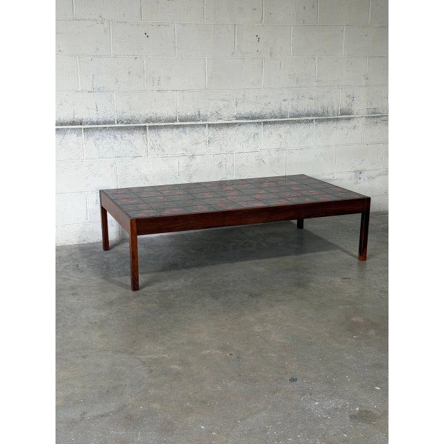 This rectangular coffee table features a fully tiled top surface. The bold graphic pattern perfectly complements the clean...