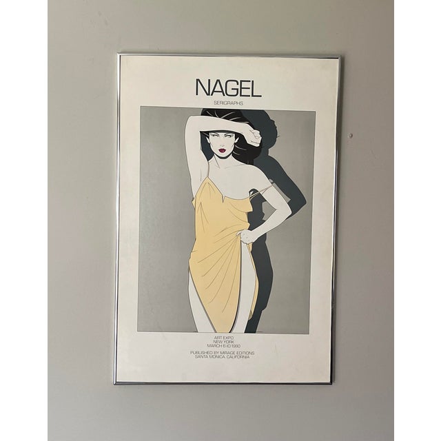 1980 Patrick Nagel Framed Serigraph Yellow Dress by Mirage Editions. This Art Expo New York serigraph is in a chrome frame...