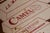 Mid 20th Century Antique Hand-Painted Buy the Carton Sign For Sale - Image 5 of 8