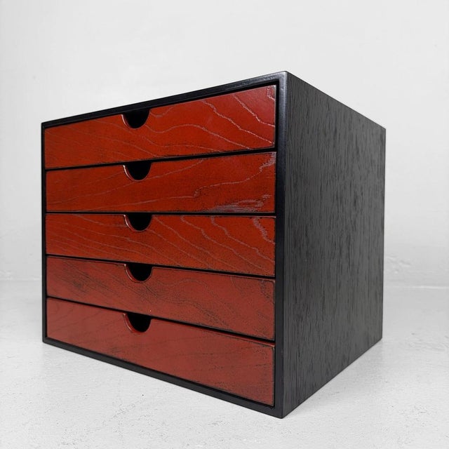 Elegant Japanese filing cabinet with five shallow drawers, executed in a beautiful combination of deep black lacquer and...